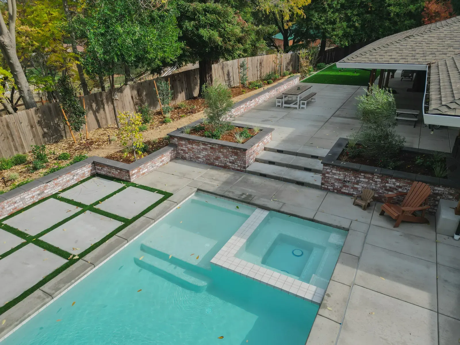 Concrete pavers set in a turf grid beside a pool deck